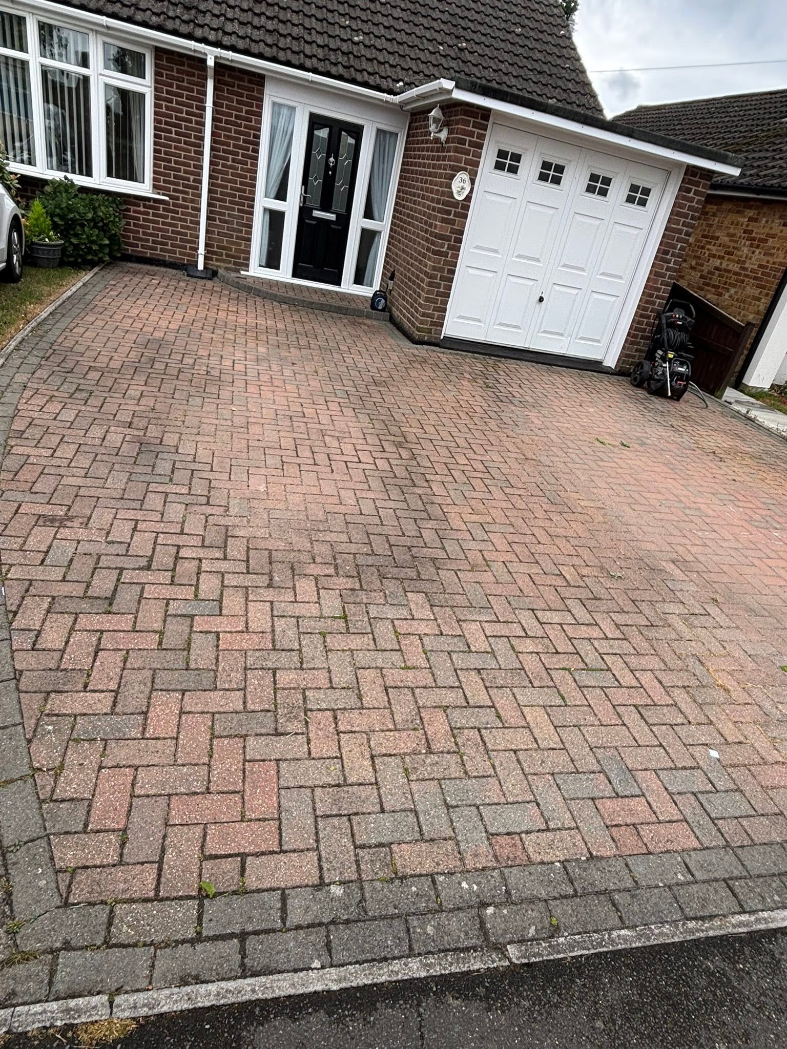 Patio before cleaning — moss and algae build-up