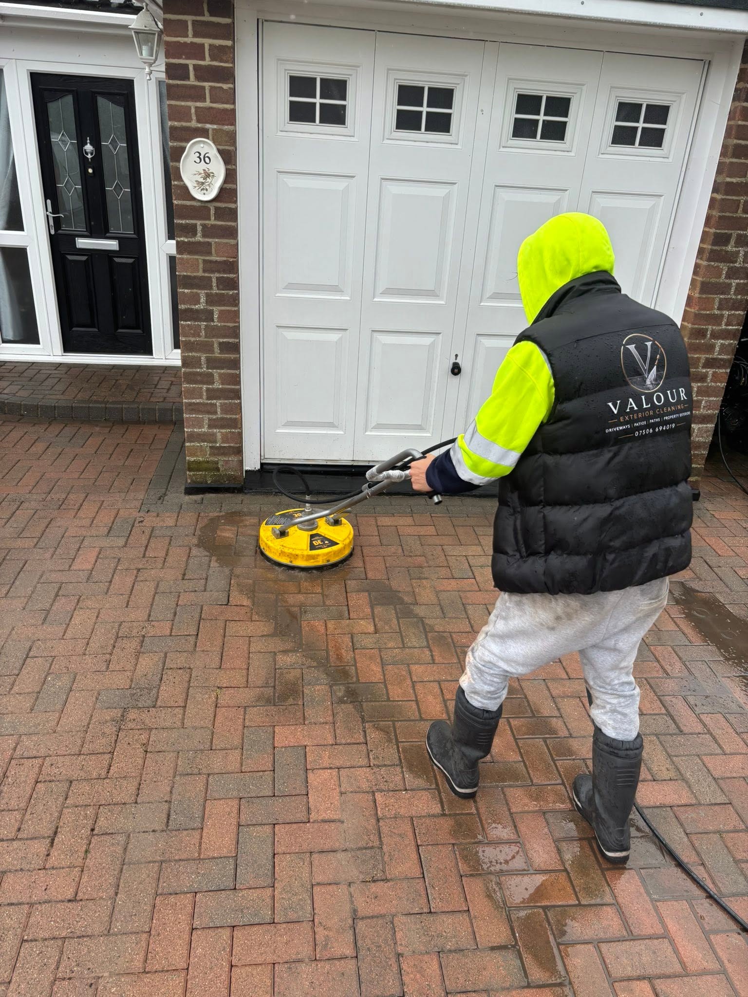 Valour team cleaning a driveway