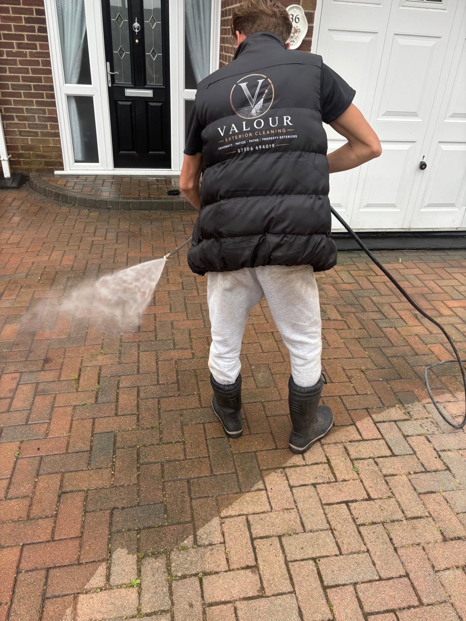 Valour team washing a patio